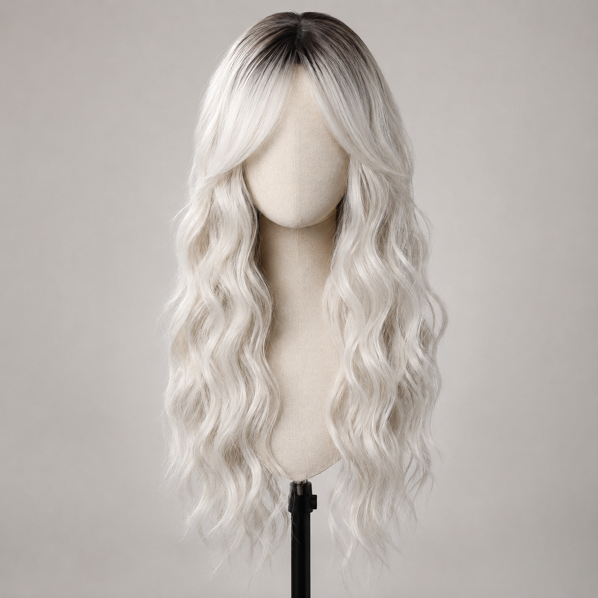SILKORA 24 inch wavy full-head wig in Champagne Blonde with shadow root, front view on mannequin bust