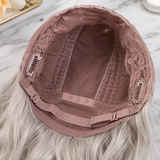 SILKORA 24 inch wavy full-head wig, rose-mesh cap interior showing combs and adjustable straps