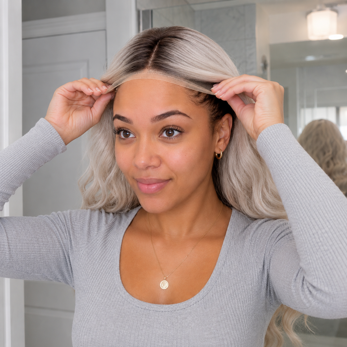 SILKORA 24 inch wavy full-head wig in Champagne Blonde, close-up of curtain bangs and lace hairline on model